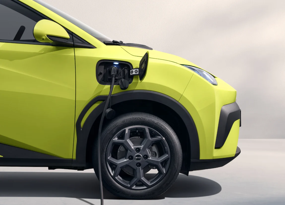 An electric car plugged in and charging