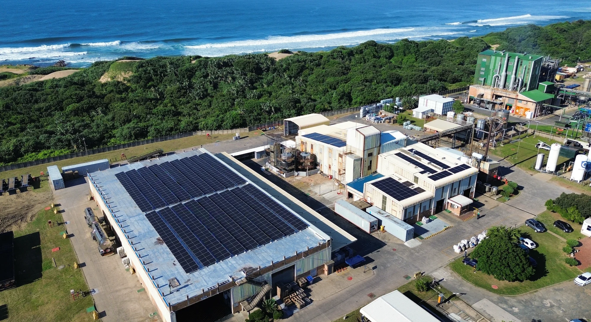 Aerial view of a Halfway Charge rooftop solar plant on the coast